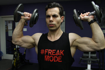 Alex Savva performing high-volume FREAKMODE workout with dumbbells